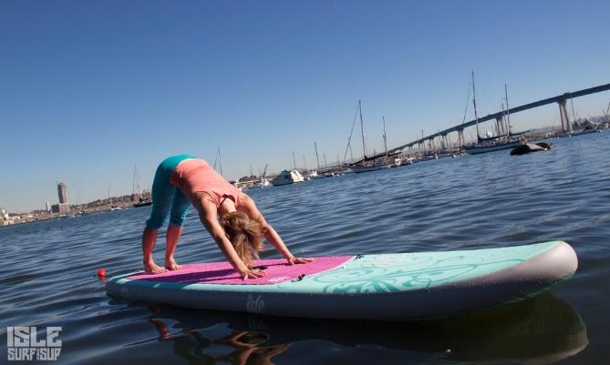 paddle board yoga downward dog